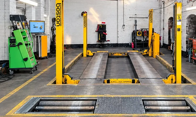 Our MOT bay with Boston four-post lift, roller brake tester and Bosch emissions tester.